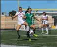  ?? MICHAEL P. PAYNE — FOR THE NEWS-HERALD ?? Mentor’s Kiki Josipovic and Mayfield’s Emma Buda vie for the ball during their nonconfere­nce match Sept. 14 at Mayfield.