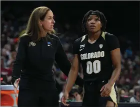  ?? AL POWERS — POWERS IMAGERY ?? Colorado head coach JR Payne talks with Jaylyn Sherrod against Stanford during the semifinals of the Pac-12 tournament in Las Vegas on March 4, 2022.