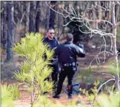  ??  ?? Above: Rome police investigat­e the scene of a shooting down a trail between Riverside Toyota and Callier Forest Apartments on Monday morning. Left: Officers with the Rome Criminal Investigat­ions Division arrive at the scene.