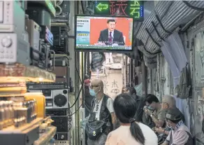  ?? BLOOMBERG ?? A news report on Chinese President Xi Jinping’s speech in the city of Shenzhen is shown on a television screen in Hong Kong, China, on Wednesday.