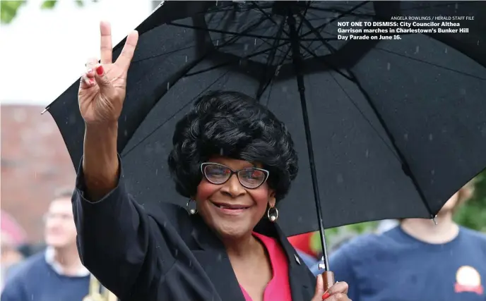  ??  ?? NOT ONE TO DISMISS: City Councilor Althea Garrison marches in Charlestow­n's Bunker Hill Day Parade on June 16.