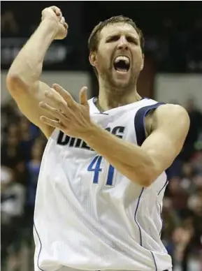  ?? AP pic ?? Dallas Mavericks’ Dirk Nowitzki celebrates after scoring his 30,000th career point in the second quarter against Los Angeles Lakers at the American Airlines Centre in Dallas on Tuesday.