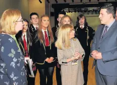  ??  ?? Announceme­nt Mr Hepburn, pictured with St Ambrose High head teacher Ellen Douglas, used his visit to announce £3m in nationwide funding allowing pupils to learn languages