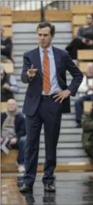  ?? JOHN BLAINE — FILE PHOTO — FOR THE TRENTONIAN ?? Princeton coach Mitch Henderson made the right moves in his team’s comeback win over Iona on Saturday.