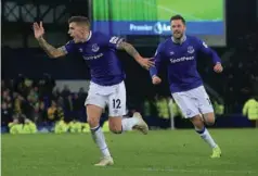  ?? (AFP) ?? Everton’s Lucas Digne (left) celebrates after scoring against Watford.