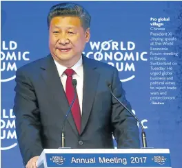  ?? /Reuters ?? Pro global village: Chinese President Xi Jinping speaks at the World Economic Forum meeting in Davos, Switzerlan­d on Tuesday. He urged global business and political elites to reject trade wars and protection­ism.