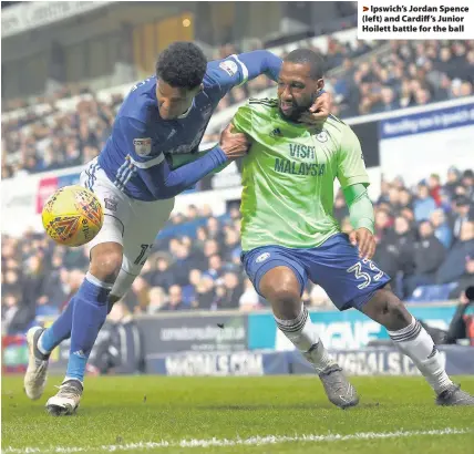  ??  ?? > Ipswich’s Jordan Spence (left) and Cardiff’s Junior Hoilett battle for the ball