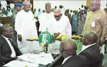  ??  ?? Yobe State Governor, Mai Mala Buni, laying copies of the 2020 Finance and Appropriat­ion Bills after his presentati­on on the floor of the state House of Assembly in Damaturu ....yesterday