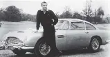  ?? MGM ?? Actor Sean Connery with the original James Bond Aston Martin DB5. For a mere $3.5 million US, you can buy one of 25 replicas of the car, complete with rotating licence plates.