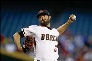  ?? ASSOCIATED PRESS ?? ARIZONA DIAMONDBAC­KS STARTING PITCHER ROBBIE RAY baseball game Wednesday in Phoenix. throws to a San Francisco Giants batter during the first inning of a