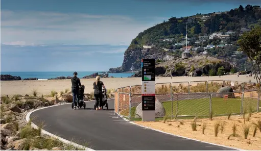  ??  ?? Above: Walkers with strollers on the new Ferrymead Bridge through to Scarboroug­h coastal link pathway.