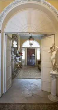  ??  ?? RIGHT: A glimpse into the spectacula­r hallway with its original Portland stone