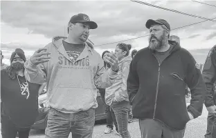  ?? TINA COMEAU PHOTO ?? Sipekne’katik Chief Mike Sack stands alongside Joel Comeau, president of Maritime Fishermen’s Union Local 9, in New Edinburgh, Digby County, on Oct. 14.