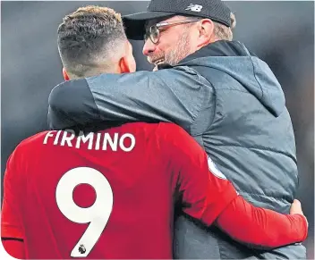  ??  ?? Boss Jurgen Klopp with Roberto Firmino, who has been huge for for Liverpool this term