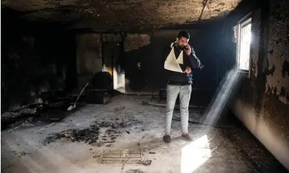  ?? Photograph: Amir Levy/Getty Images ?? A Palestinia­n man in the remains of his home in Huwara, West Bank, 27 February 2023.