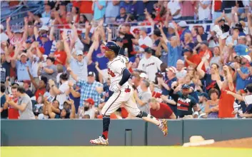  ?? JOHN BAZEMORE/ASSOCIATED PRESS ?? Atlanta’s Ozzie Albies rounds first base after hitting a three-run home run last July 4 against Philadelph­ia. Owners gave the go-ahead Monday to making a proposal to the players’ union that could lead to the coronaviru­s-delayed season.