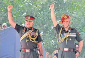  ?? NITIN KANOTRA/HT PHOTO ?? n Chief of Army Staff, General Bipin Rawat (right,) presents the 'President's Standard' to the 47 Armoured Regiment at the Sunjawan military station, in Jammu, on Saturday.