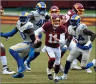  ?? GREG FIUME/GETTY IMAGES ?? Alex Smith (11) of the Washington Football Team scrambles during the second quarter against the Los Angeles Rams on Oct. 11 at FedExField in Landover, Md.