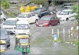  ?? ARVIND YADAV/ HT ?? Commuters wade through a waterlogge­d stretch on Vikas Marg near ITO, in New Delhi, on Monday.