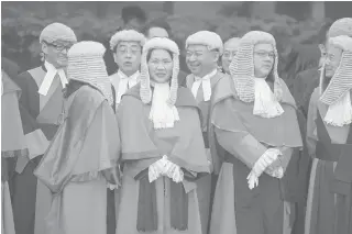  ?? AFP/VIVEK PRAKASH ?? Judges wearing robes and horsehair wigs attending a ceremony held to mark the opening of the legal year in Hong Kong on January 8. Heavyweigh­ts from Hong Kong’s legal community are going into battle with the city’s government as fears grow that rule of...