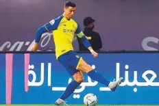  ?? AFP ?? ■ Al Nassr’s Portuguese forward Cristiano Ronaldo runs with the ball during the Saudi Pro League match against Al Ittifaq.
