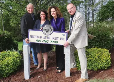  ?? Photo by Ernest A. Brown ?? Lucien Michaud, owner of Michaud Auto Body on Privilege St., Woonsocket, left, joins Director of Human Services Linda Plais, Mayor Lisa Baldelli-Hunt, and Armand Desmarais, volunteer and coordinato­r for the city’s new Adopt-aSpot program, places a new...