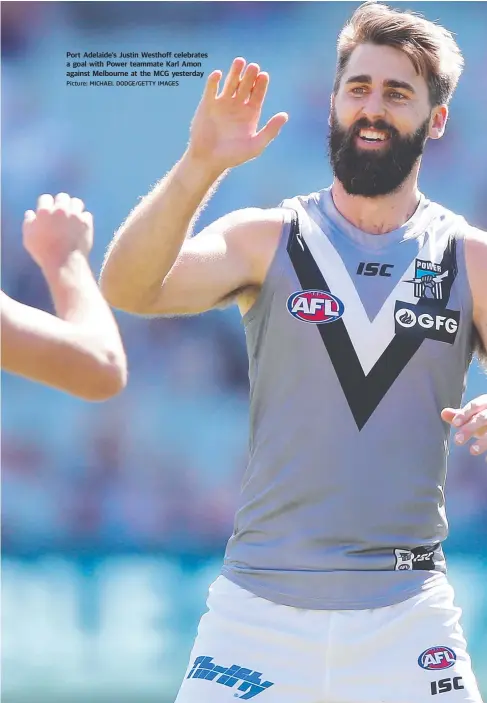  ?? Picture: MICHAEL DODGE/GETTY IMAGES ?? Port Adelaide’s Justin Westhoff celebrates a goal with Power teammate Karl Amon against Melbourne at the MCG yesterday