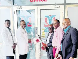  ?? LEON JACKSON ?? From left: Dr Rouaj Shirley, Dr Dale Foster, Mayor C. Junior Gager, Garth Wilkinson councillor for the Falmouth division, and Rev Junior Rutty, representi­ng Custos Hugh Gentles, at the ribbon-cutting ceremony to open the Omega Medical Centre in Falmouth.