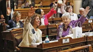  ?? BOB ANDRES / BANDRES@AJC.COM ?? State Sens. Horacena Tate (front left) and Nan Orrock, both D-Atlanta, vote during the session Wednesday. Behind them are Sens. Elena Parent, Nikema Williams and Sally Harrell, all Atlanta Democrats. There are now 72 women in the 236-member General Assembly.