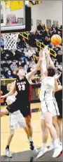  ?? Mark Humphrey/Enterprise-Leader ?? Pea Ridge and Prairie Grove players battle for a rebound during the Blackhawks’ 5444 win in 4A-1 boys basketball action Friday at Prairie Grove’s Tiger Arena. The teams could meet again in the district tournament Wednesday, Feb. 15, at Berryville if Prairie Grove beats Shiloh Christian on Tuesday.