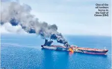  ??  ?? One of the oil tankers burns in the Gulf of Oman (DM)