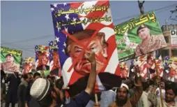  ?? MOHAMMAD SAJJAD/THE ASSOCIATED PRESS ?? A protester holds a sign that reads, "we condemn Trump’s accusation­s," referring to the U.S. president’s allegation that Pakistan harbours militants.