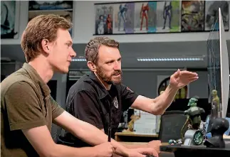  ?? PHOTO: WETA WORKSHOP/STEVE UNWIN ?? Weta Workshop art director Paul Tobin, right, with concept artist Logan Preshaw.