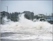  ?? ANDREW VAUGHAN — THE CANADIAN PRESS VIA AP ?? Waves batter the shore in Cow Bay, Nova Scotia, on Wednesday.