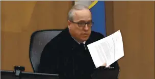  ?? COURT TV VIA AP ?? In this image from video, Hennepin County Judge Peter Cahill reads instructio­ns to the jury before closing arguments Monday in the trial of former Minneapoli­s police officer Derek Chauvin at the Hennepin County Courthouse in Minneapoli­s.