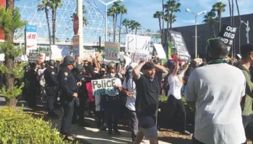  ?? Photo by Greggory Moore ?? Anti-police brutality demonstrat­ion in the wake of the George Floyed protest in Long Beach this past June.