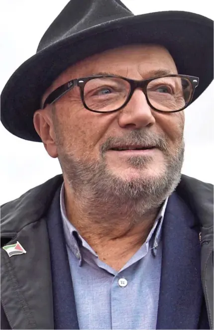  ?? ?? The firebrand in the fedora: George Galloway outside his Workers Party HQ in Rochdale this week