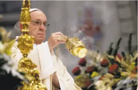  ?? Andrew Medichini / Associated Press ?? Pope Francis celebrates an Epiphany Mass in St. Peter’s Basilica at the Vatican. Francis urged his listeners to help the poor and others in need of assistance.