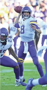  ??  ?? Vikings quarterbac­k Kirk Cousins has led Minnesota to an 8-2 record over its last 10 games. The defense forced seven turnovers Sunday against the Los Angeles Chargers.