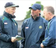  ??  ?? DELIGHT Offaly manager Kevin Ryan comes up with a gameplan with assistants to topple Westmeath - it worked!