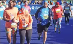  ?? Picture: PHANDO JIKELO/ANA PICTURES ?? BITTER END: Cape Town Marathon 10km runners chase the cut-off time, leaving some in tears as they couldn’t run anymore.