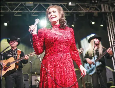  ??  ?? In this March 17, 2016 file photo, Loretta Lynn performs at the BBC Music Showcase at Stubb’s during South By Southwest in Austin, Texas. Lynn’s new book, ‘Me
& Patsy Kickin’ Up Dust: My Friendship with Patsy Cline,’ was released on April 7. (AP)