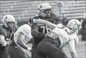  ?? Courtesy photo / University of Colorado athletics ?? Colorado offensive tackle William Sherman battles outside linebacker Joshka Gustav during a scrimmage Saturday at Folsom Field.