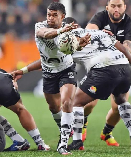  ??  ?? Fiji Airways Flying Fijians halfback, Simione Kuruvoli, passes the ball during the Test Match against the All Blacks at Forsyth Barr Stadium on July 10, 2021 in Dunedin, New Zealand. Young players like Kuruvoli have proved themselves and could be selected to be part of the Fijian Drua in the Super Rugby Pacific 2022.