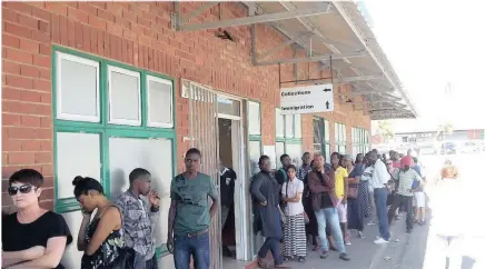  ??  ?? People queue at the Home Affairs centre in Umgeni Road, Durban. The service was supposed to have been upgraded some time ago, but complaints are now mounting of not only poor service but also the state of the department’s shabby buildings.