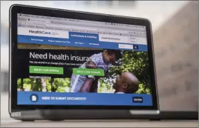  ?? AP PHOTO/ANDREW HARNIK ?? In this Feb. 9 file photo, the HealthCare.gov website, where people can buy health insurance, is displayed on a laptop screen in Washington.