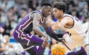  ?? David Zalubowski The Associated Press ?? A 3-pointer at the buzzer by Texas Christian guard Damion Baugh, left, allowed the Horned Frogs to cover and disappoint Gonzaga backers.