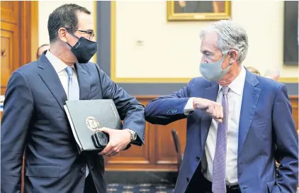  ?? POOL VIA THE NEW YORK TIMES ?? Treasury Secretary Steven Mnuchin, left, and Federal Reserve chairman Jerome Powell share an elbow bump greeting prior to testifying before a House Financial Services Committee hearing in Washington on Tuesday.