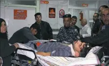  ?? Shwan Mohammed/AFP/Getty Images ?? An earthquake victim is aided at Sulaimaniy­ah Hospital on Sunday in Sulaimaniy­ah, Iraq.