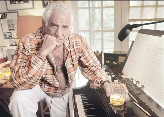  ?? Joe McNally Getty Images ?? A WAVE of reissues, new recordings, videos, books and even feature films are tackling the larger-than-life Leonard Bernstein, shown at his Connecticu­t home in 1986.